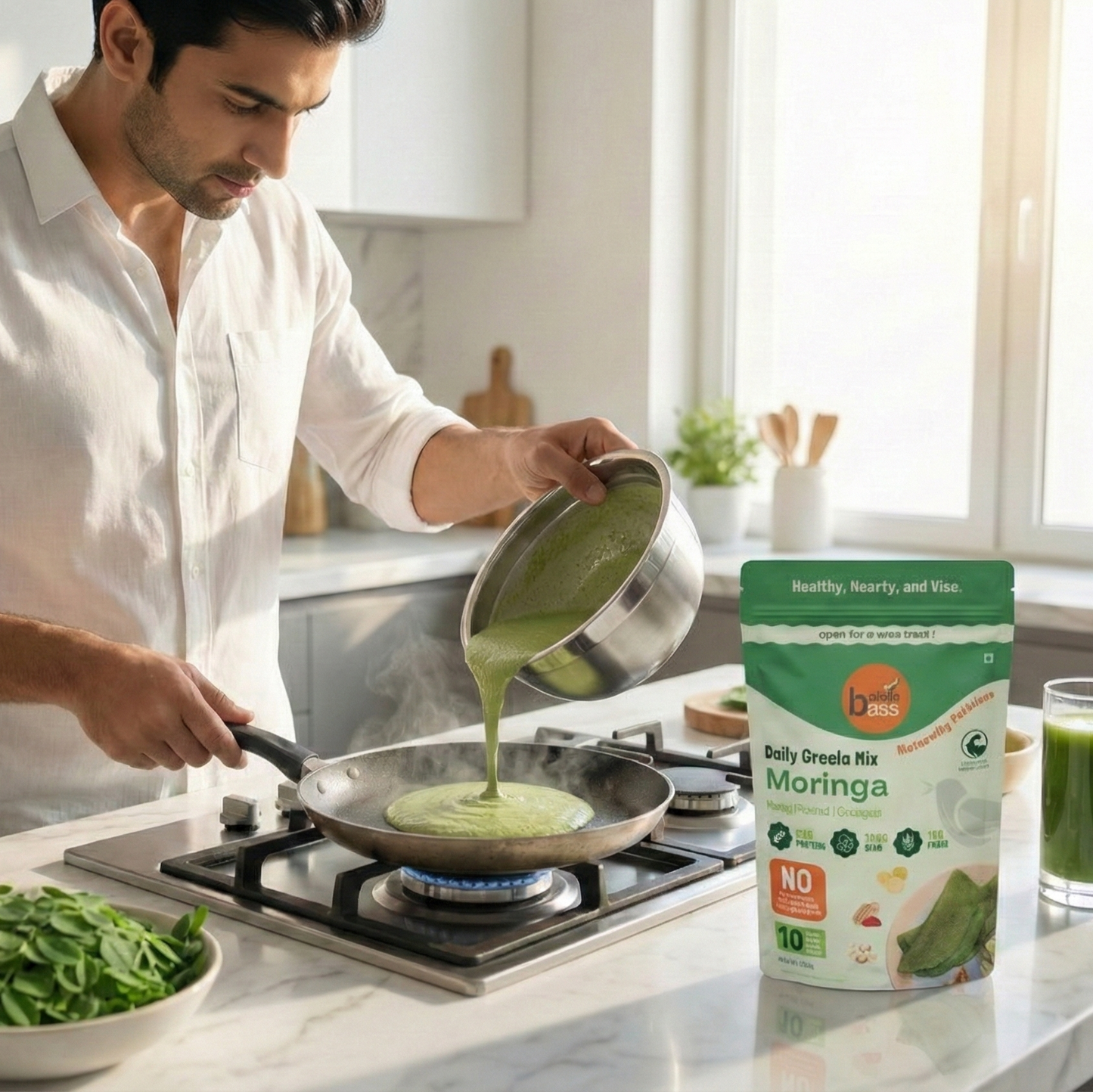 Man cooking green dish in kitchen with Moringa powder packaging nearby